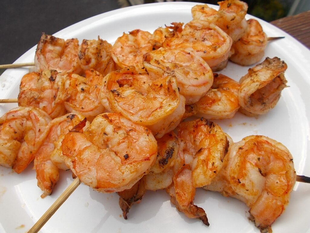 A plate of shrimp on a stick.