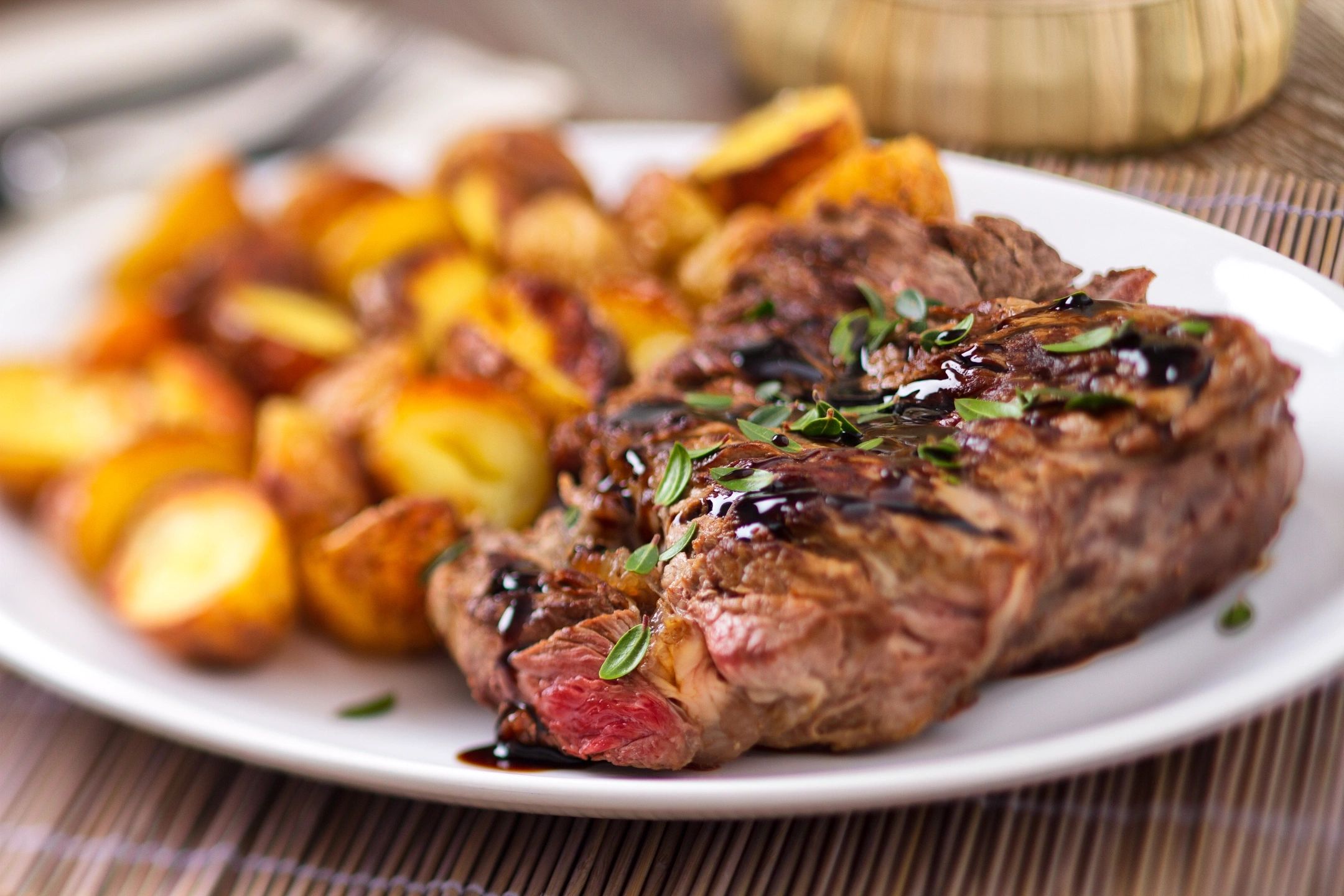 A plate of food with meat and potatoes on it.